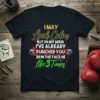 Black t-shirt with yellow and green text saying "I May Look Calm But In My Mind I've Already Punched You