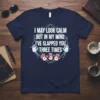Navy t-shirt with white text: "I May Look Calm But In My Mind I've Slapped You Three Times" and red