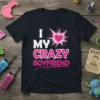 I MY CRAZY BOYFRIEND text design with a pink heartburst graphic on a black t-shirt