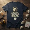 I Need A Freaking Break quote with alarm clock and coffee cup graphic on a navy blue t-shirt