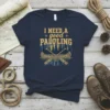 Navy blue t-shirt with yellow text "I NEED A good PADDLING" and a graphic of a canoe with paddles