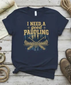 Navy blue t-shirt with yellow text "I NEED A good PADDLING" and a graphic of a canoe with paddles