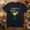 I Need A Huge Margarita text with a graphic of a margarita cocktail on a black t-shirt