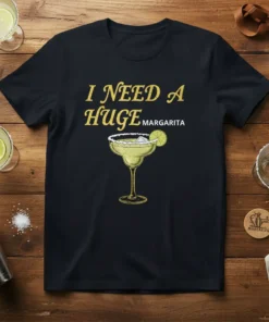 I Need A Huge Margarita text with a graphic of a margarita cocktail on a black t-shirt