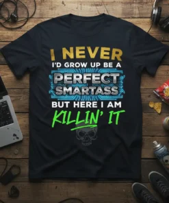 Black t-shirt with gold, blue, and green text: "I Never I'd Grow Up Be A Perfect Smartass But Here I