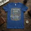 Blue t-shirt featuring the quote "I Never Lose I Either Win Or Learn ~ Nelson Mandela" in ornate steampunk-inspired gold