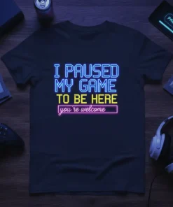 I Paused My Game To Be Here you're welcome neon text design on a dark t-shirt for gamers