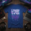 I Paused My Game To Be Here gamer t-shirt with pixelated controller graphic in neon colors