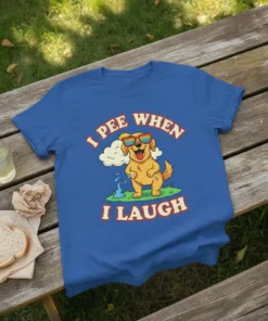 Golden retriever dog wearing sunglasses, peeing when laughing, with text "I Pee When I Laugh" on a blue t-shirt