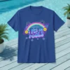 Blue t-shirt with the text "I Pee In Pools" in bold, colorful, retro font, featuring a rainbow, smiley faces, and