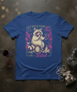 I Put The Bi In Bitch t-shirt design with a raccoon holding wine and decorative border