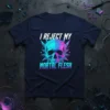 I Reject My Mortal Flesh quote on a t-shirt with a geometric, neon-colored skull graphic