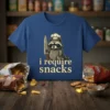 I Require Snacks t-shirt design with a raccoon chef holding a knife and text "i require snacks"