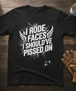 Black t-shirt with white distressed text "I Rode Faces I Should've Pissed On" and wing graphic