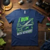Navy t-shirt with neon green text "I RUN WITH SCISSORS" and graphic of scissors with runners