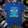Retro Easter bunny wearing sunglasses and a chain, with neon graphics and text "I Said The Hipity The Hoppity To