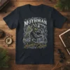 I saw Mothman kissing Santa Claus text and illustration on a dark t-shirt, festive holiday design