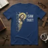 Jesus peeking from behind a brick wall on a navy t-shirt with white text "I SAW THAT!" and a halo