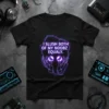 Black t-shirt with neon purple text "I SLUSH BOTH OF MY NOOBZ EQUALLY" above two glowing purple orbs held by