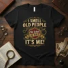 Funny "I Smell Old People Oh Wait It's Me!" quote t-shirt with vintage shield graphic and distressed typography