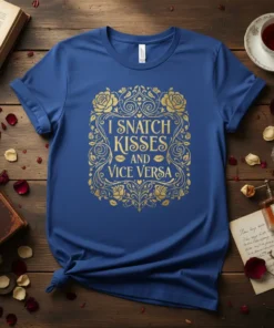 I SNATCH KISSES AND VICE VERSA quote t-shirt with decorative floral and kiss graphics in gold foil on a royal