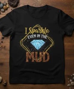 I Sparkle EVEN IN THE MUD quote with a blue diamond graphic on a black t-shirt