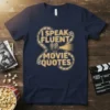 T-shirt with "I Speak Fluent Movie Quotes" text in vintage film reel design and projector graphic