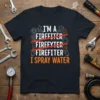 Firefighter T-Shirt with "I'm a Firefighter" crossed out and "I Spray Water" in bold orange text