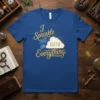 I Sprinkle THIS ON FAITH Everything quote on a blue t-shirt with a stylized cloud and sunburst graphic