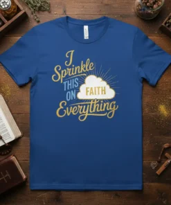 I Sprinkle THIS ON FAITH Everything quote on a blue t-shirt with a stylized cloud and sunburst graphic