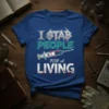 Blue t-shirt with "I STAB PEOPLE FOR A LIVING" text and a syringe graphic, featuring a rock-style font and blood