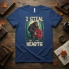 I STEAL HEARTS Bigfoot design with a creature holding a heart, set in a forest