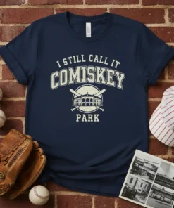 Navy blue t-shirt with "I STILL CALL IT COMISKEY PARK" in vintage collegiate font and stadium graphic