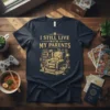 I Still Live With My Parents t-shirt with a vintage illustration of a cozy living room scene, featuring a cat