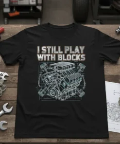 I Still Play With Blocks t-shirt design featuring a detailed V8 engine blueprint graphic and bold text
