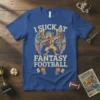 I Suck At Fantasy Football t-shirt with a winged creature holding a football, text in distressed font