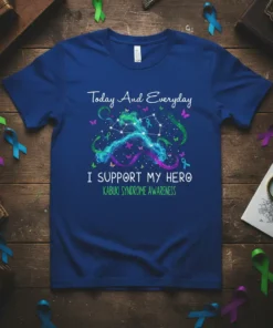 T-shirt with "I Support My Hero Kabuki Syndrome Awareness" text and colorful ribbon graphics