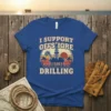 I SUPPORT OFFSHORE DRILLING text on a blue t-shirt with a vintage oil rig graphic and sunset