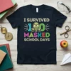 I Survived 100 Masked School Days t-shirt with gas mask graphic and colorful text