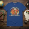 I SURVIVED 87 DAYS OF SCHOOL text with graduation cap and stack of books graphic on a blue t-shirt
