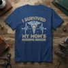 I SURVIVED MY MOM'S NURSING DEGREE text with Caduceus and heartbeat graphic on navy t-shirt