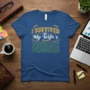 I Survived My Wife's Doctorate Program text design with laurel wreaths and an open book graphic on a blue t-shirt