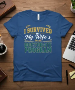 I Survived My Wife's Doctorate Program text design with laurel wreaths and an open book graphic on a blue t-shirt