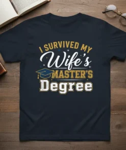 I Survived My Wife's Master's Degree text design with graduation cap graphic, white and gold lettering on navy t-shirt