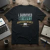I Survived My Wife's Masters Degree t-shirt with distressed text and an open book graphic