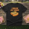 Black t-shirt with "I Swallow Juicy Weiners" text above two cartoon hot dogs with mustard and relish