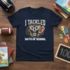 I Tackled 10 Days Of School t-shirt design with a football-playing raccoon mascot and the number 100