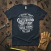 I TAUGHT YOUR GIRLFRIEND THAT THING THING YOU LIKE text design on a dark navy t-shirt, featuring heart and wings