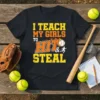 I Teach My Girls To Hit & Steal softball t-shirt with bold orange and yellow text and baseball graphic