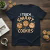 I TEACH SMART COOKIES text with three cute cartoon cookies wearing glasses on a navy t-shirt
